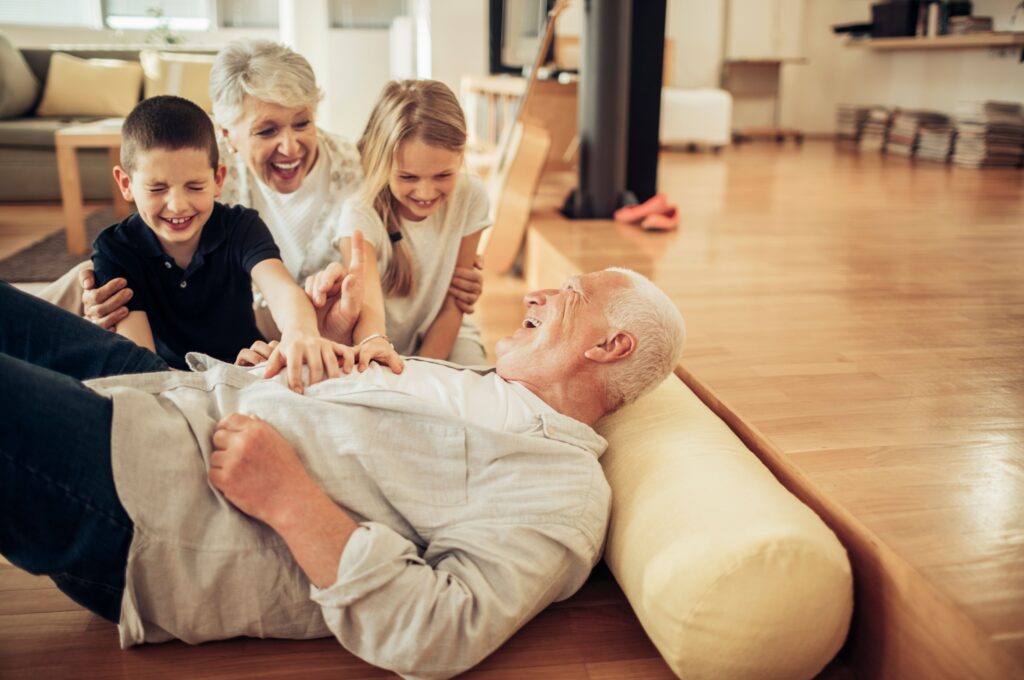 Grandparents playing with their grandchildren.